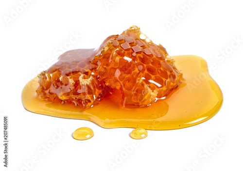 Honeycomb and honey isolated on white background
