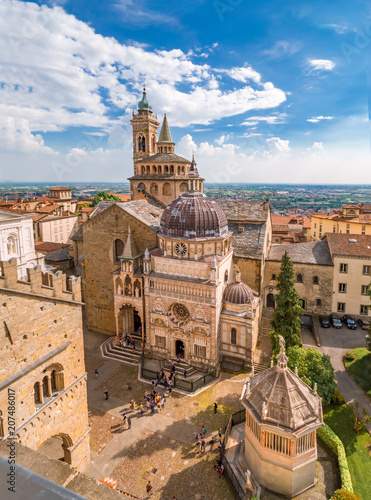 Aerial view of the Basilica of Santa Maria Maggiore and Cappella Colleoni in Citta Alta of Bergamo, Italy on a sunny day