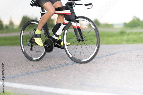 Cyclist in maximum effort in an asphalt road outdoors