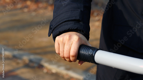 Exercise and health. Hands holding on to the grip of an exercise device