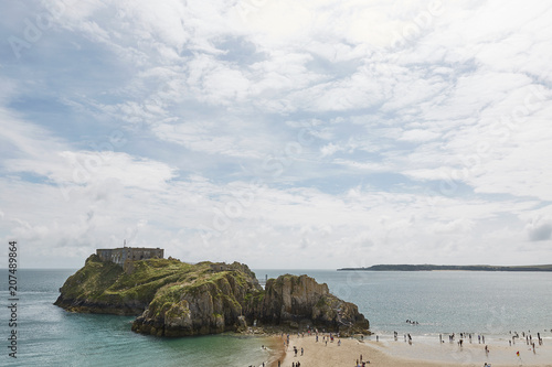 People at the beach in Tenby, Wales, UK.