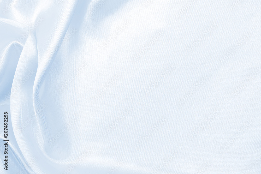 Obraz premium Smooth elegant blue silk or satin luxury cloth texture as abstract background. Luxurious background design