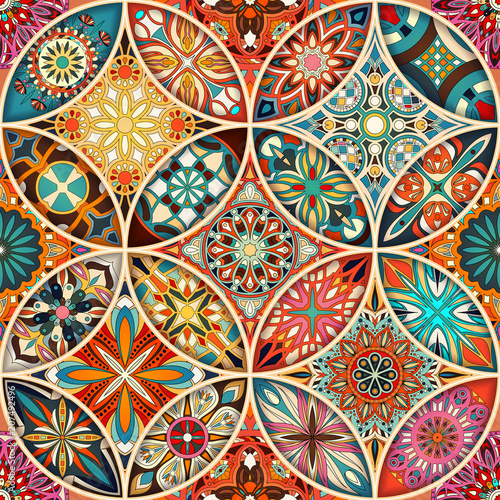 Seamless pattern with decorative mandalas. Vintage mandala elements.