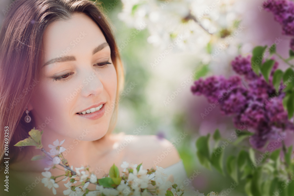 Close up romantic portrait of beautiful elegant woman in blossom spring trees. Close up romantic portrait of beautiful elegant woman in blossom spring trees.