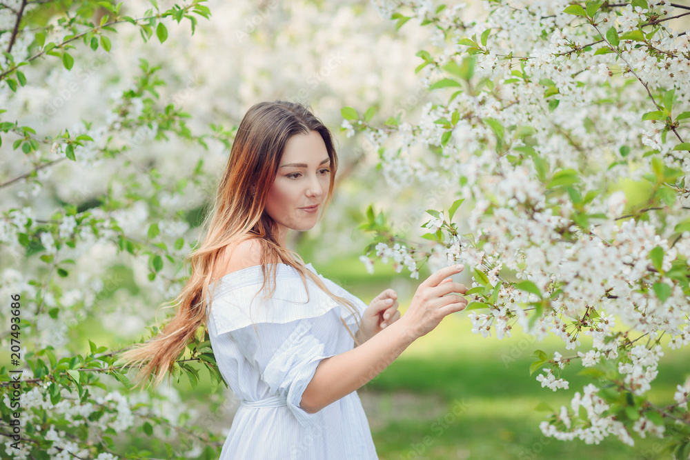 Close up romantic portrait of beautiful elegant woman in blossom spring trees. Close up romantic portrait of beautiful elegant woman in blossom spring trees.