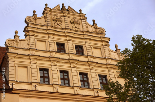 Verzierter Giebel von Schloss Ortenburg vor strahlend blauem Himmel photo