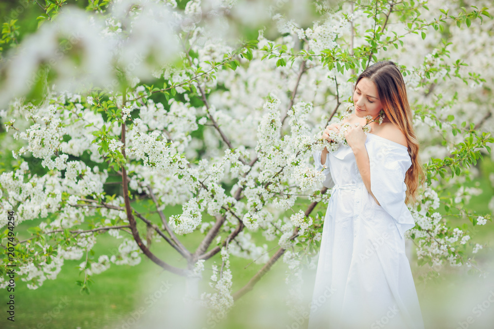 Close up romantic portrait of beautiful elegant woman in blossom spring trees. Close up romantic portrait of beautiful elegant woman in blossom spring trees.