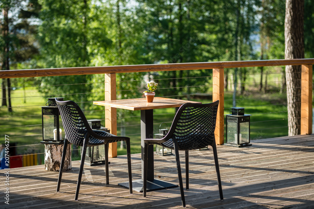 Chairs and table cafes on the outdoor terrace. Chairs and table cafes on the outdoor terrace.