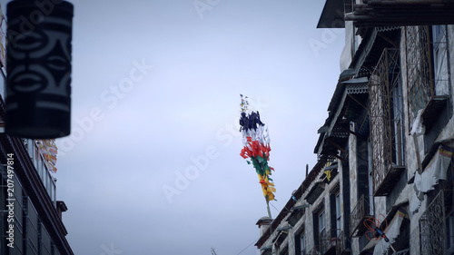 Close up of tibet flag on the top of the building