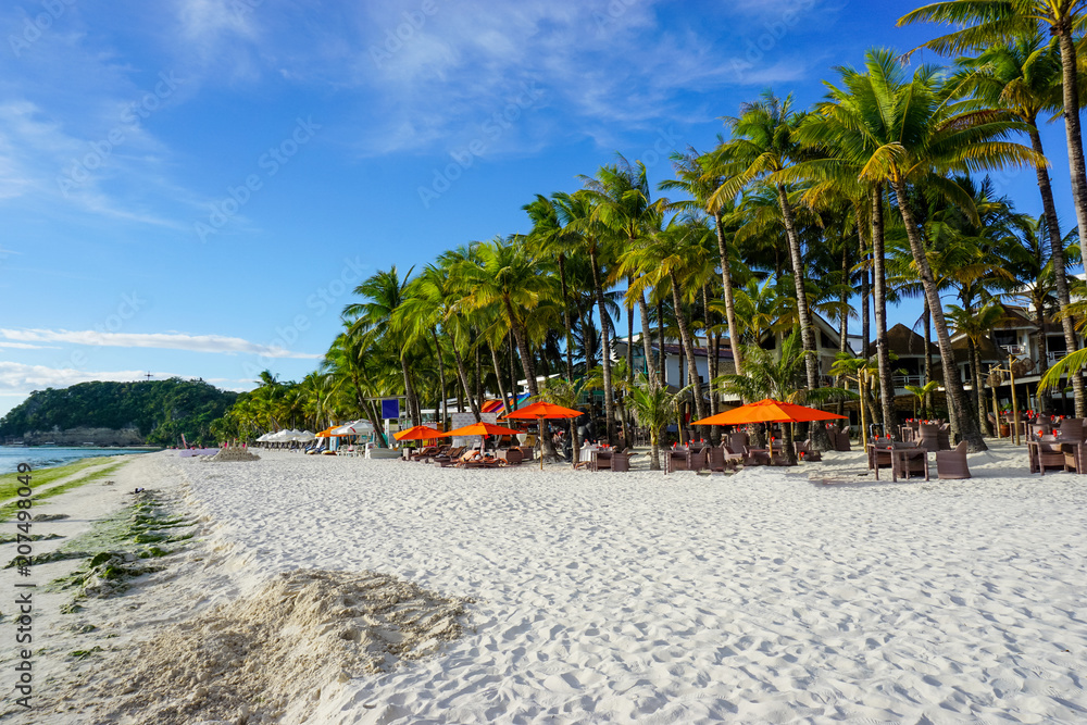 White sand beach with palm trees of Boracay