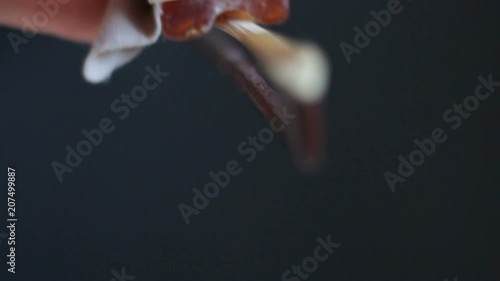 Applying rosin to a violin bow