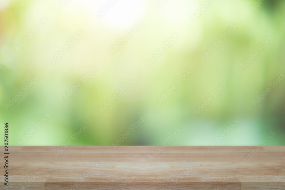 Empty wooden desk of free space and spring time with blurred background of home garden for a catering or food background,Template mock up for display montages of product. Empty wooden desk of free space and spring time with blurred background of home garden for a catering or food background,Template mock up for display montages of product.