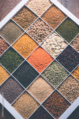 Indian Beans,Pulses,Lentils,Rice and Wheat grain in a white wooden box with cells, selective focus. © Arundhati