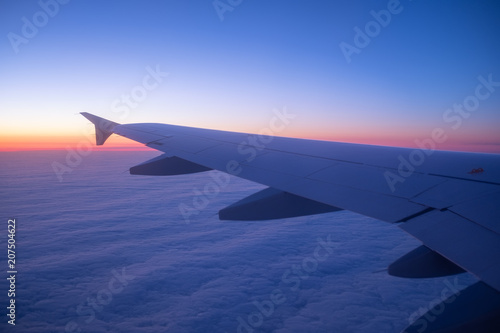 Aircraft wind on the sunrise sky background. Composition of aircraft