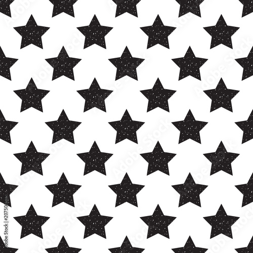 Geometric seamless pattern of black stars with glitter isolated on white background.