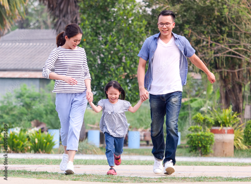 Happy family playing in the park. Happy family playing in the park.
