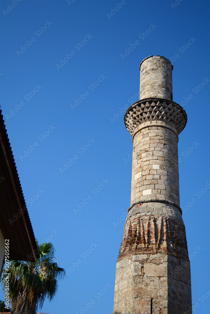 Minaret without top of the 13th century in the ancient district in Antalya, Turkey