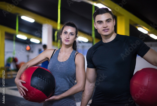 young athletes couple working out with medical ball © .shock