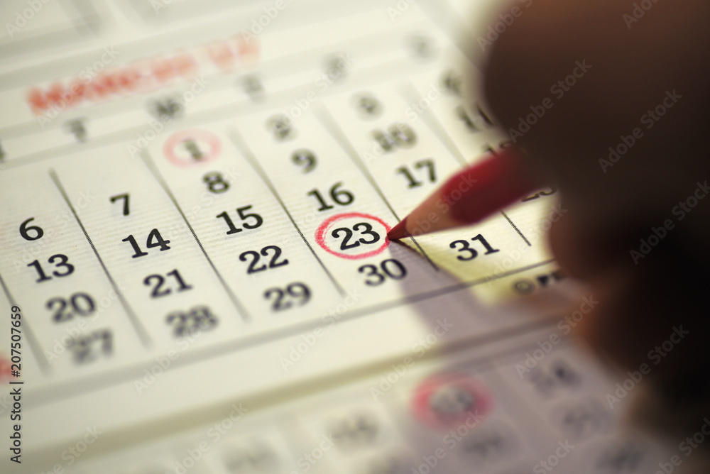 Twenty third Day of the month marked with marked in the calendar with red pencil Twenty third Day of the month marked with marked in the calendar with red pencil