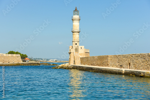 Lighthouse in the historical venetian port of Chania. The greek city on the north coast of Crete is one of the most beautiful towns on the island