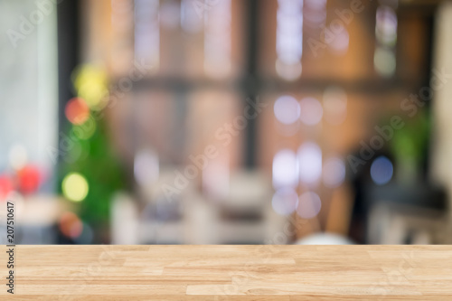 Empty wooden table and blurred cafe background, can be used for display or montage your products