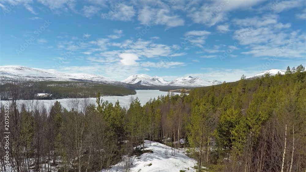 Panorama view of forest and frozen lake in Norway Rondane National Park Sohlbergplassen Panorama view of forest and frozen lake in Norway Rondane National Park Sohlbergplassen
