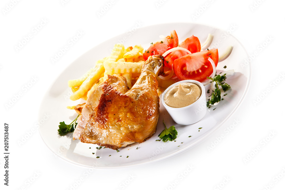 Roast chicken leg with french fries on white background Roast chicken leg with french fries on white background