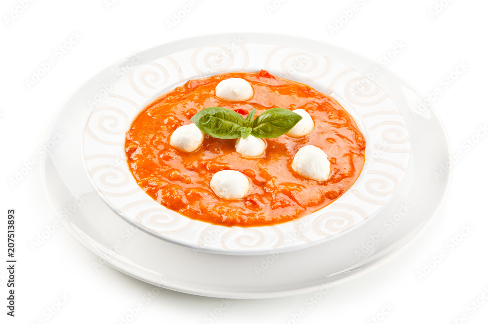 Tomato soup with mozzarella on white background Tomato soup with mozzarella on white background