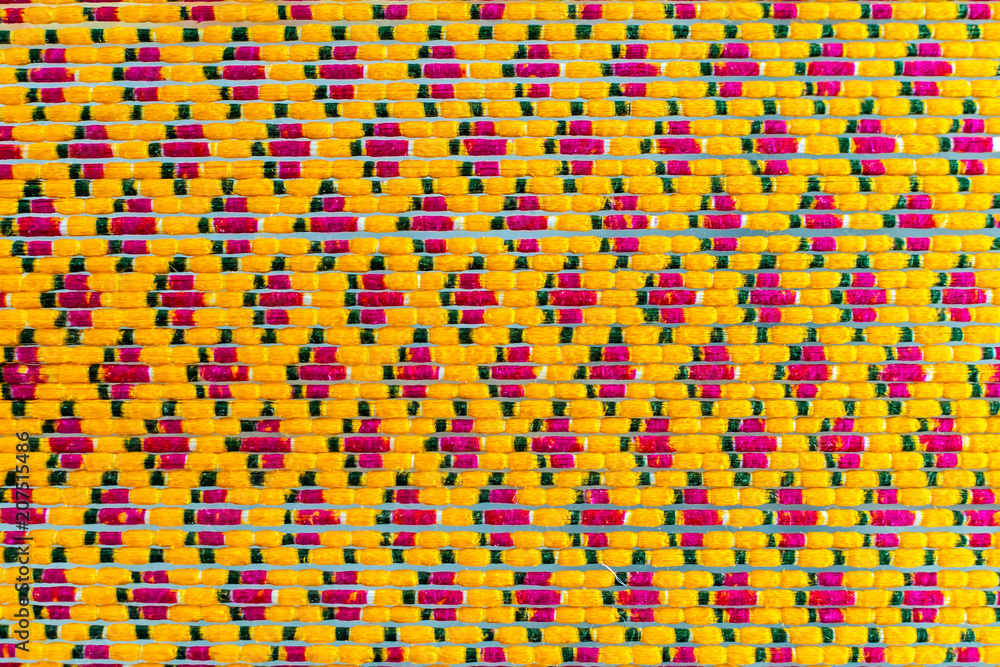 Texture of Mudmee Board Weaving or Ikat Thai Silk Pattern Weaving on Small Red Weaving Mill After Finish to Tie and Dyed Texture of Mudmee Board Weaving or Ikat Thai Silk Pattern Weaving on Small Red Weaving Mill After Finish to Tie and Dyed