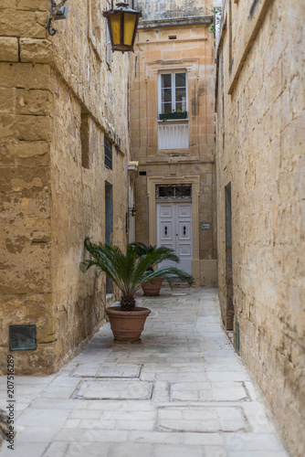 Fototapeta Naklejka Na Ścianę i Meble -  Photo of Typical street of Malta, ancient buildings and architecture