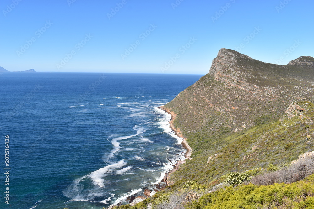 Beautiful nature with the blue raw ocean on the way to the  Cape of Good Hope in Cape Town on the Cape Peninsula Tour in South Africa