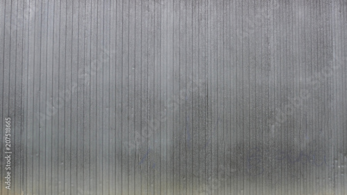 wall of gray aluminum sheets