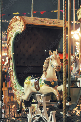 Fototapeta Naklejka Na Ścianę i Meble -  Attraction horse carousel. Holiday celebration, Christmas national fun-fair in the capital of Russia