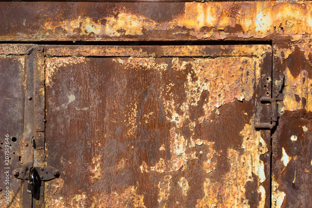Old rusty sheet metal with the remnants of cracked paint Old rusty sheet metal with the remnants of cracked paint