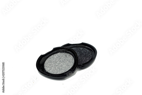 Glittering eye shadow on isolated white background photo