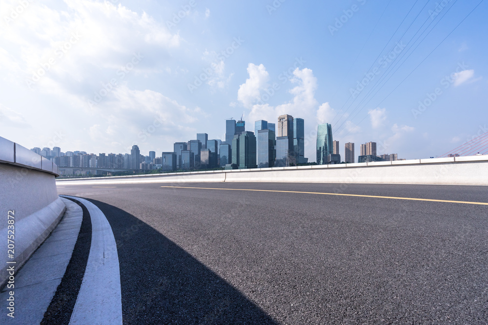 urban road with panoramic city skyline urban road with panoramic city skyline