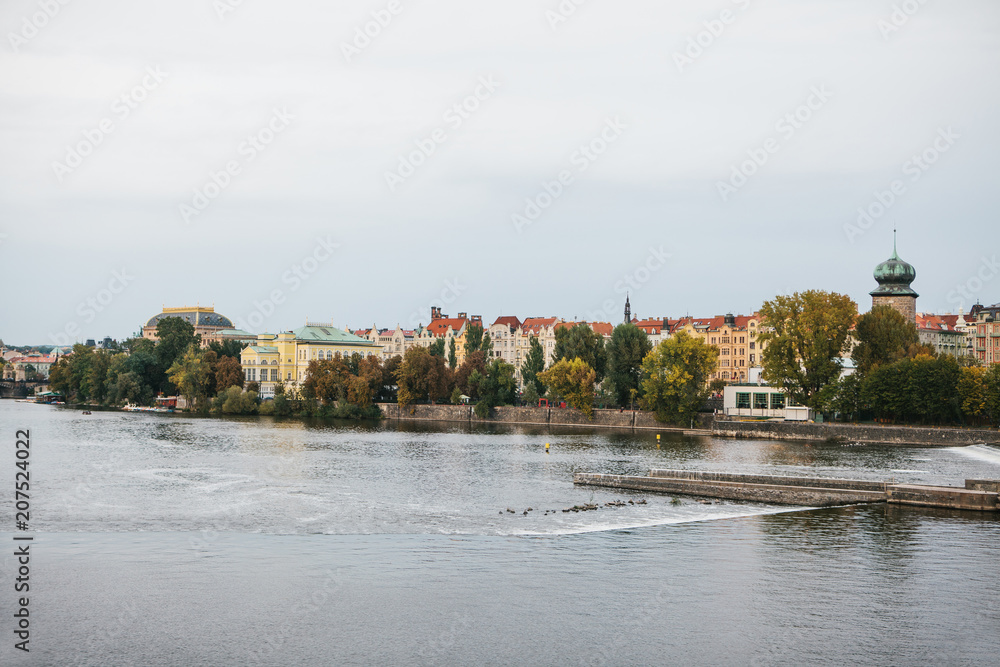Obraz premium The Vltava River. Traditional architecture of Prague in the background. Travel around the Czech Republic