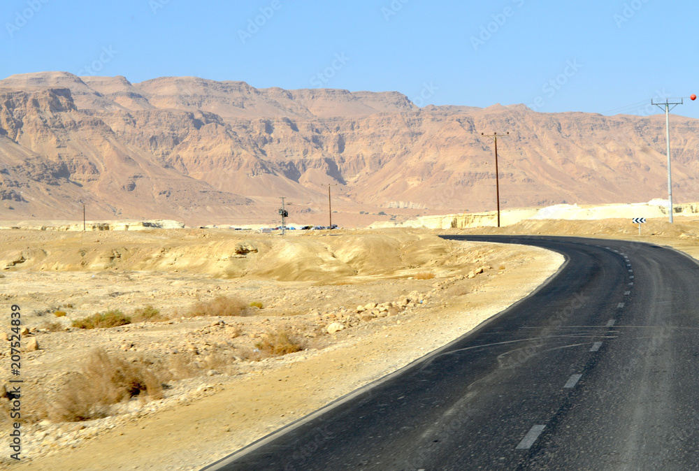 Road among beige mountains
