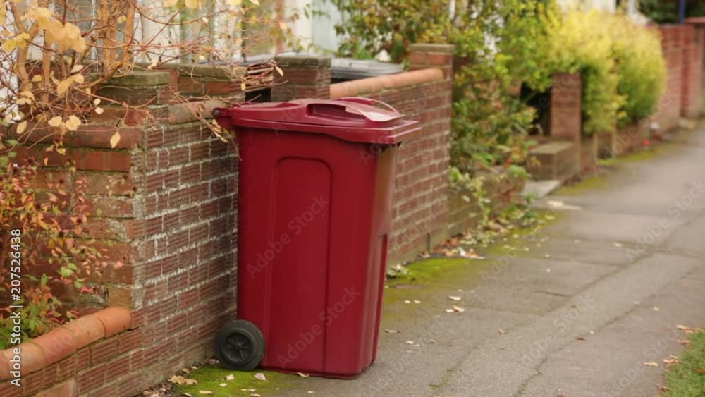 Typical rubbish bin (wheely bin) in England in the autumn Typical rubbish bin (wheely bin) in England in the autumn