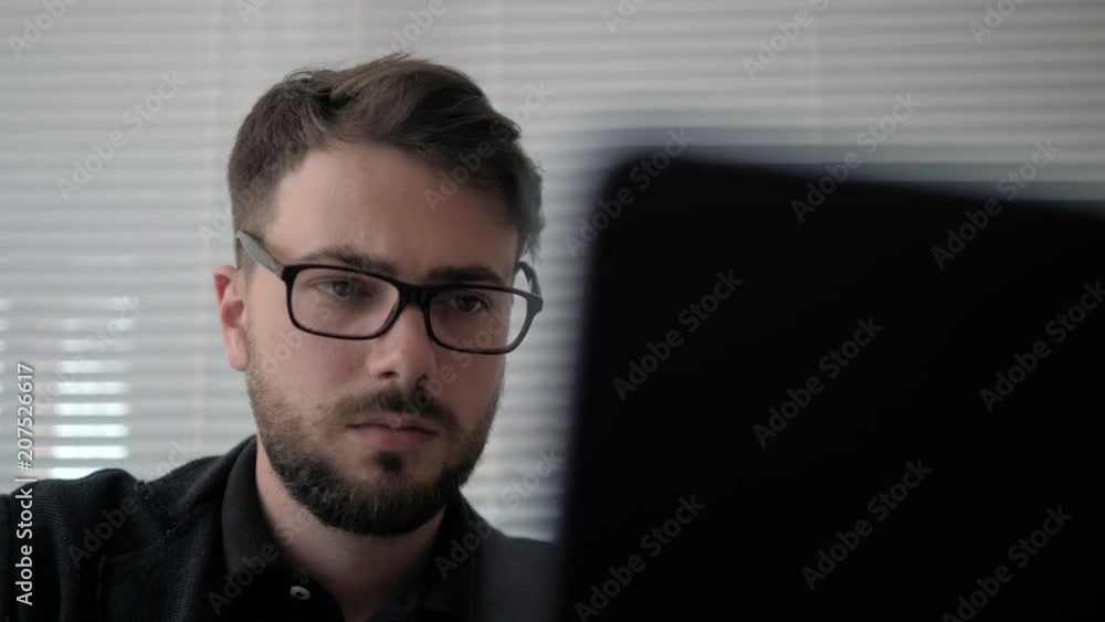 Medium cover shot of young successful man working on greenscreen laptop with statistics and graphics in glasses Medium cover shot of young successful man working on greenscreen laptop with statistics and graphics in glasses