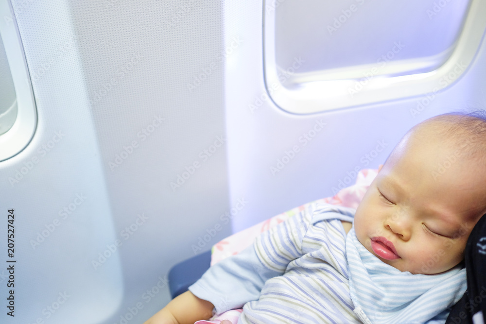 Adorable Baby Boy Sleeping On Airplane with copyspace Toddler boy