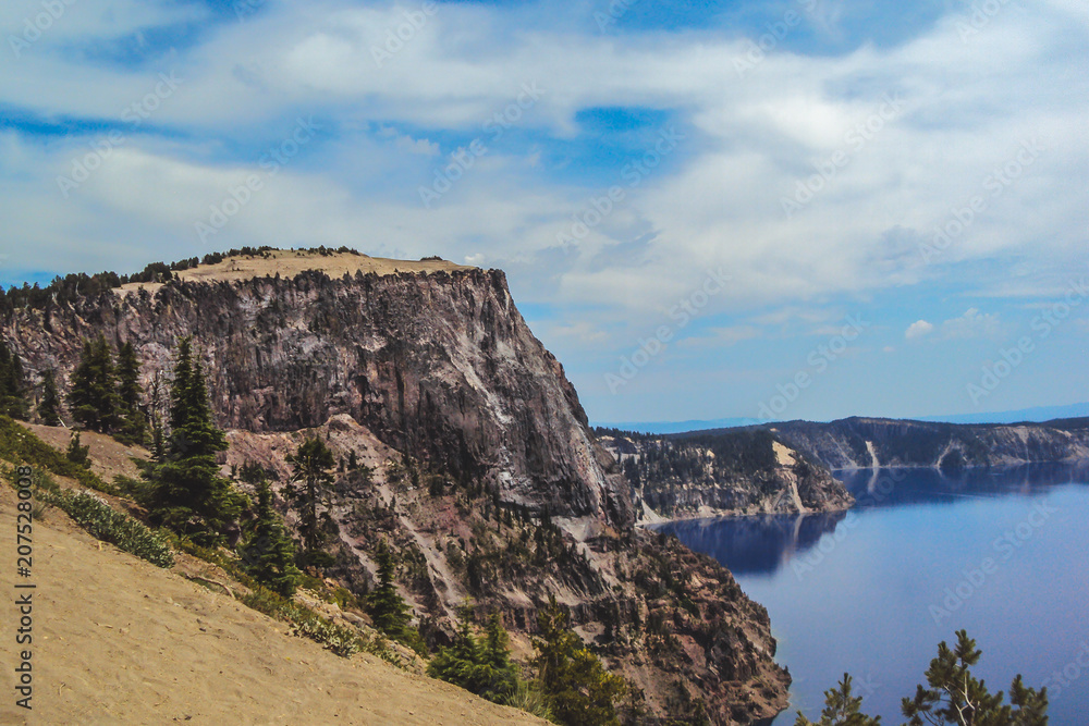 Cliff formation on the rim of Crater Lake in Oregon with a retro feel