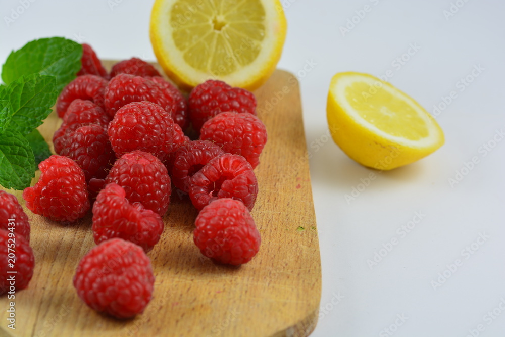 Raspberries on a wooden board Raspberries on a wooden board