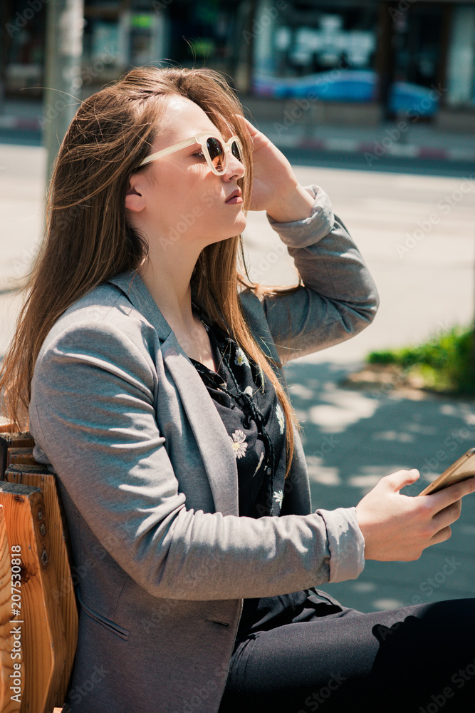 Fototapeta premium Young Business Girl Holding His Smart Phone