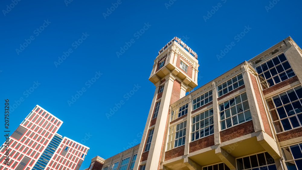 Obraz premium In the center of the Dutch city of Almelo, in the eastern part of the Netherlands near the Germany, there are two towers of an old steam mill that now is transformed to a business- and health center
