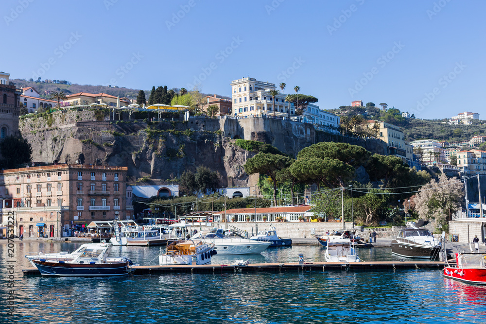View from the sea to the harbor and port of the city of Sarento, region Company, Italy Amalfi Coast - architectural and travel background