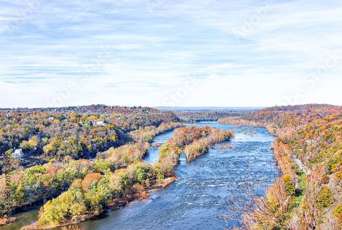 Harper's Ferry overlook with colorful orange yellow foliage fall autumn forest with small village town by Potomac river blue in West Virginia, WV photo