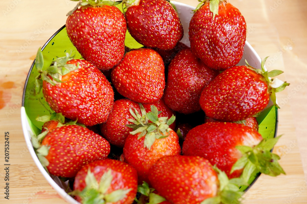 Bright fresh strawberry in a round container Bright fresh strawberry in a round container