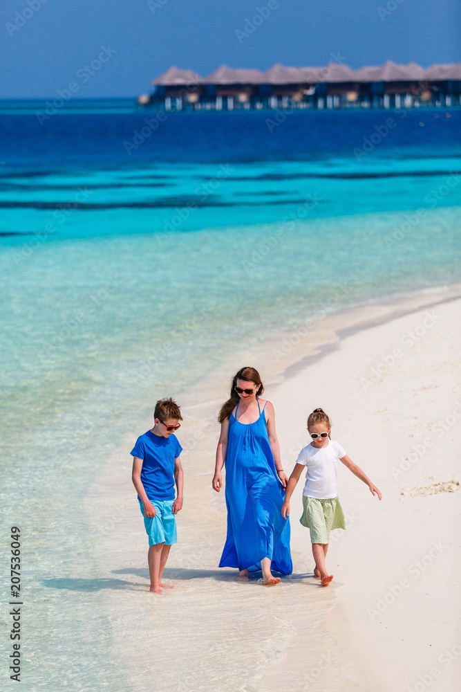 Mother and kids at tropical beach Mother and kids at tropical beach