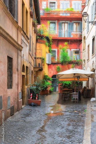 Fototapeta Naklejka Na Ścianę i Meble -  View of old cozy street in Rome, Italy. Architecture and landmark of Rome. Postcard of Rome.